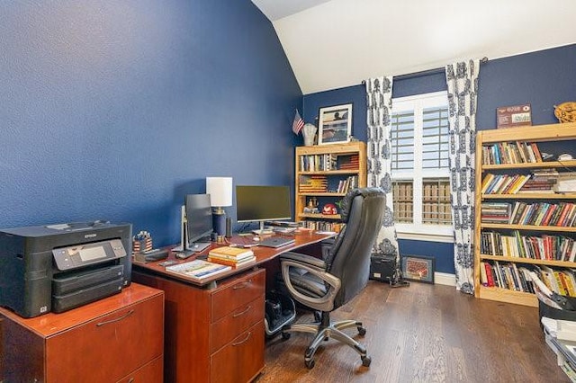 office with dark hardwood / wood-style flooring, a healthy amount of sunlight, and lofted ceiling