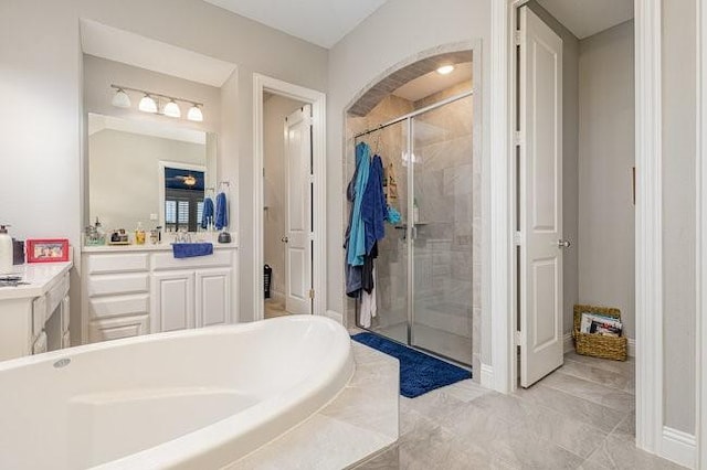 bathroom with vanity and separate shower and tub