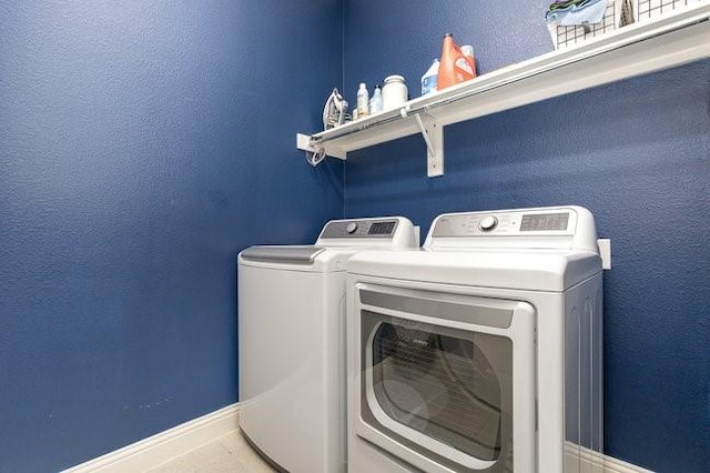 laundry room with washer and dryer