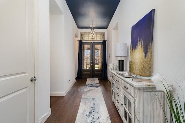 entryway with french doors and dark hardwood / wood-style floors