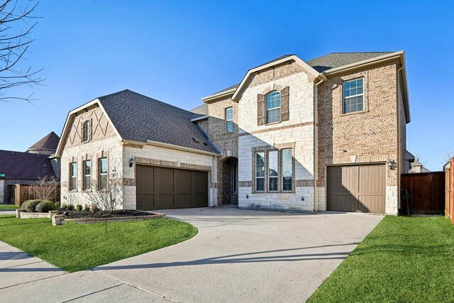 view of front of home with a garage and a front yard