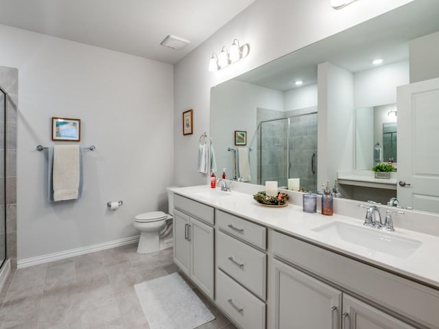 bathroom featuring toilet, vanity, and walk in shower