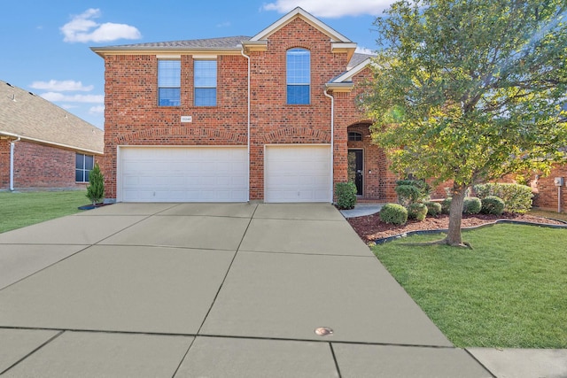 view of property with a front lawn and a garage