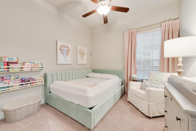 bedroom with ceiling fan, radiator heating unit, and light carpet