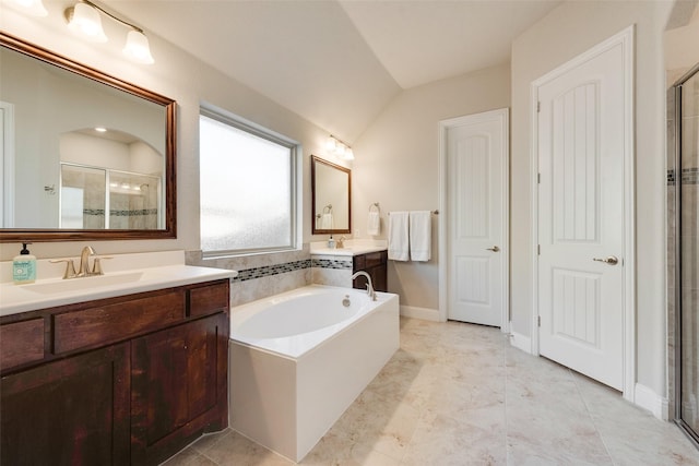 bathroom with vanity, independent shower and bath, and lofted ceiling