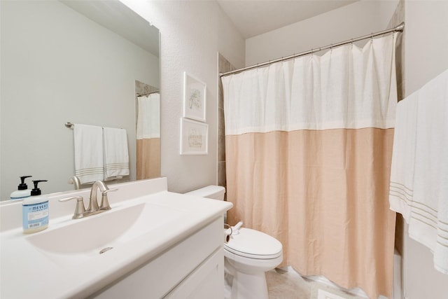 bathroom featuring vanity, curtained shower, and toilet