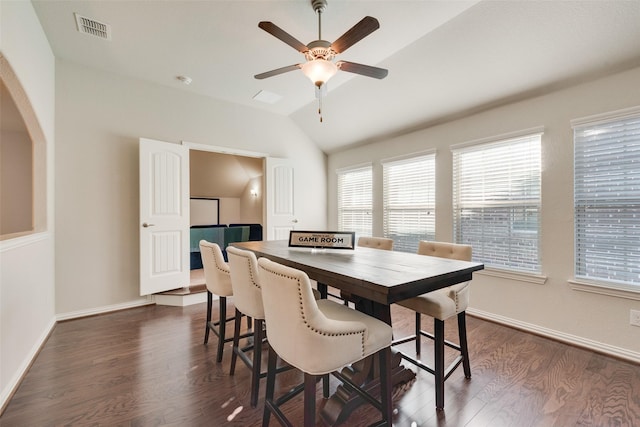 dining room with ceiling fan, dark wood-type flooring, and lofted ceiling