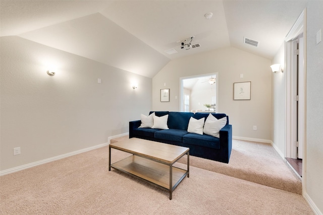 living room featuring light colored carpet, ceiling fan, and lofted ceiling