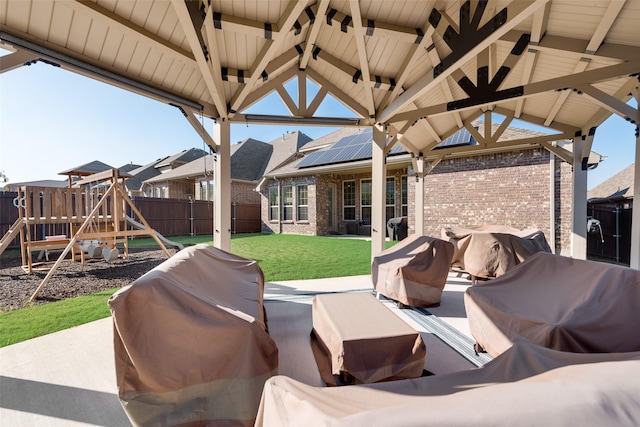 view of patio / terrace featuring a playground and grilling area