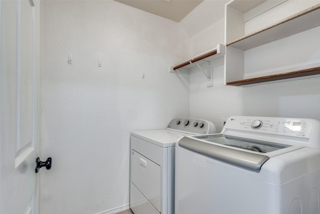 laundry room with independent washer and dryer