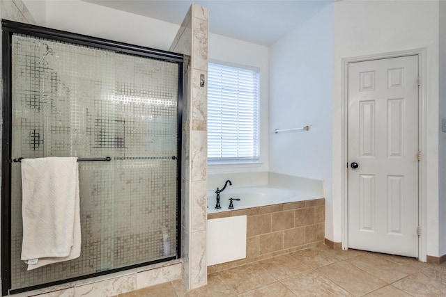 bathroom featuring independent shower and bath and tile patterned flooring