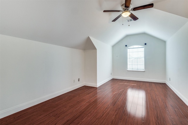 bonus room with ceiling fan, vaulted ceiling, and dark hardwood / wood-style flooring