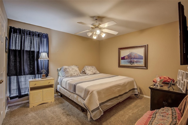 bedroom featuring ceiling fan and carpet