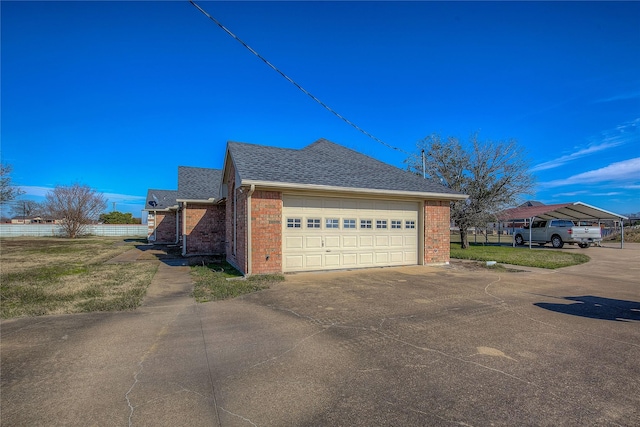 view of side of property with a garage