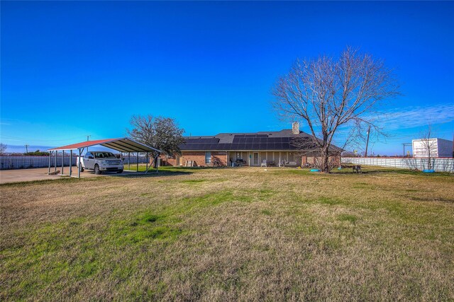 view of yard with a carport