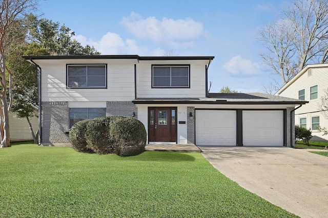 view of front property with a garage and a front lawn