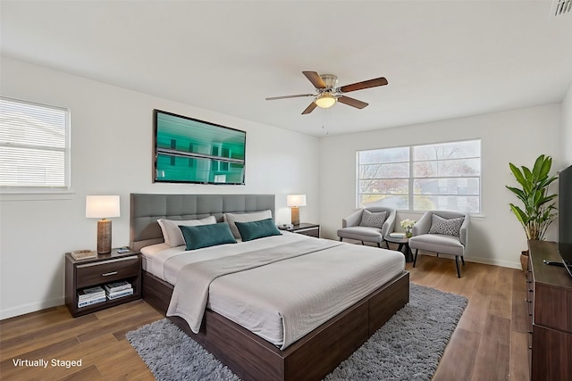 bedroom with ceiling fan and wood-type flooring