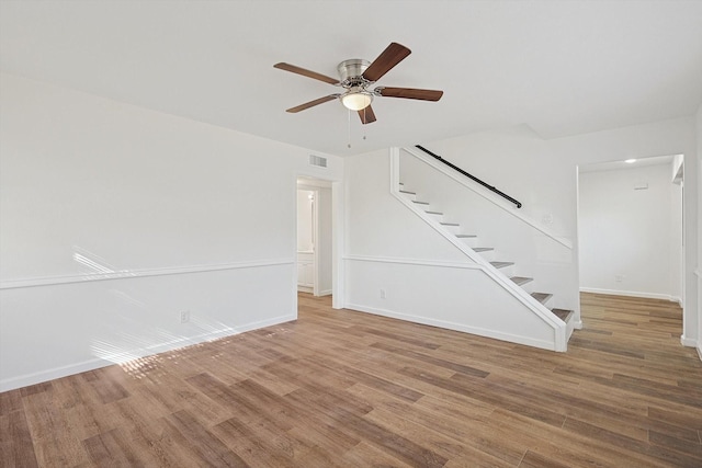 unfurnished living room with hardwood / wood-style floors and ceiling fan