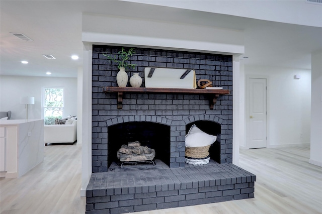 room details featuring hardwood / wood-style flooring and a fireplace