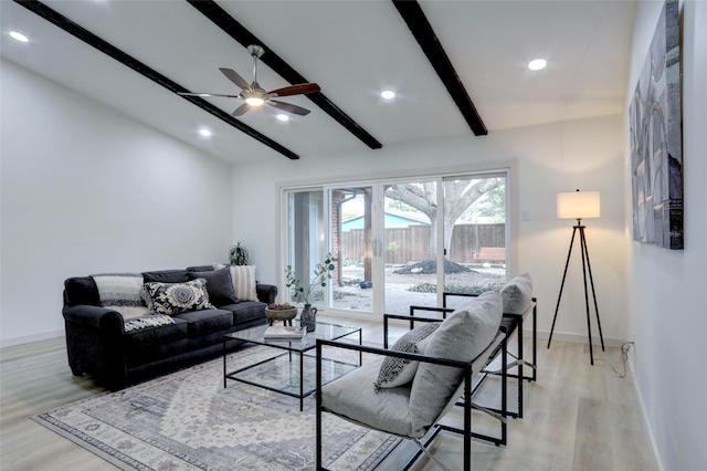 living room with beam ceiling, ceiling fan, and light hardwood / wood-style floors