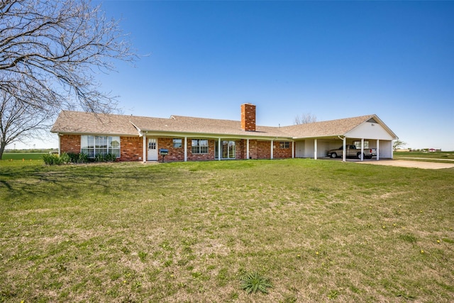 ranch-style house featuring a carport and a front lawn