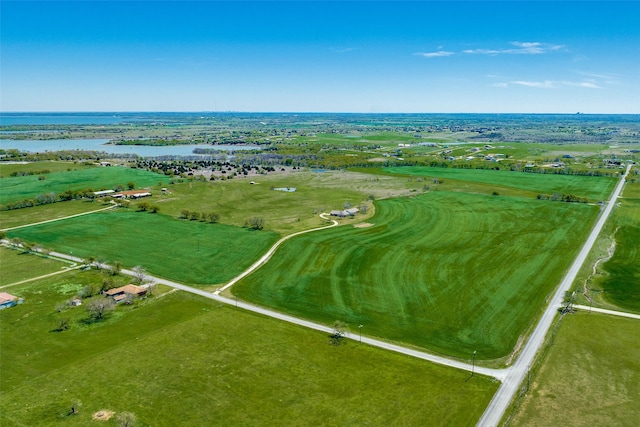 birds eye view of property with a rural view and a water view