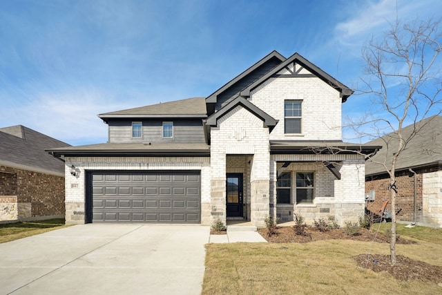 view of front of property with a garage and a front yard