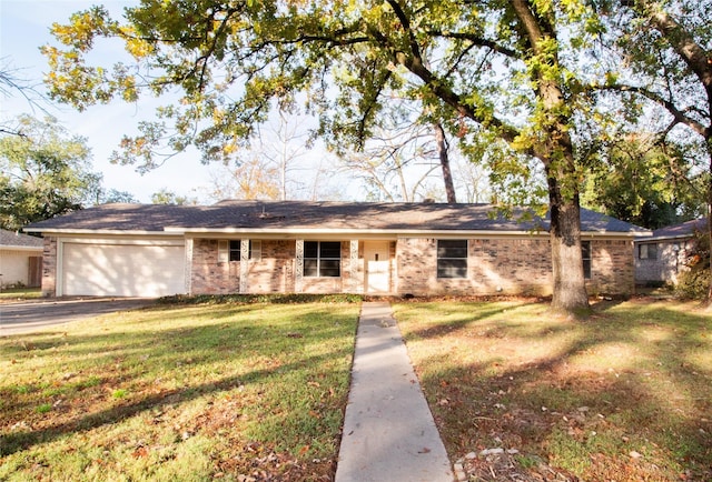 single story home with a front yard and a garage