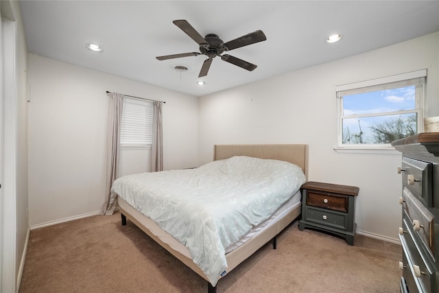 carpeted bedroom featuring ceiling fan