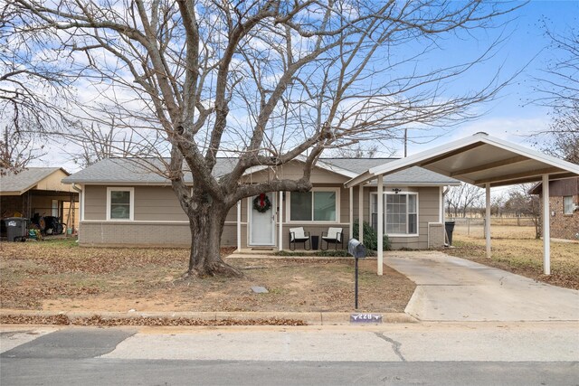 view of front of home with a carport