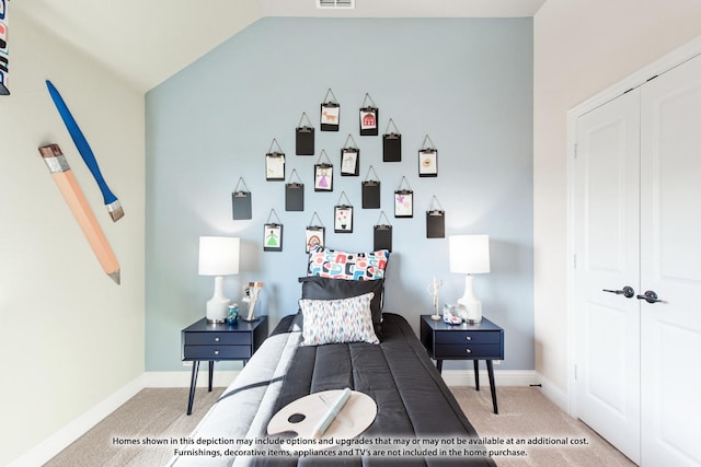 bedroom with light carpet and lofted ceiling