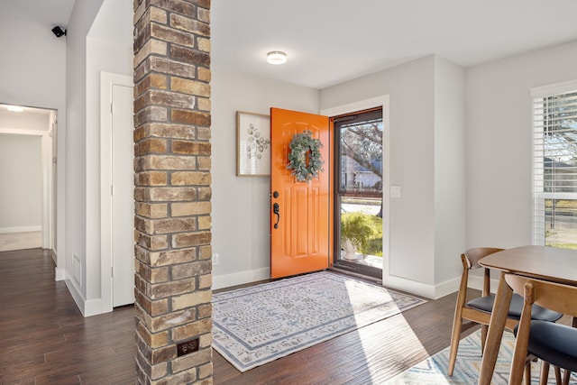 entryway with dark wood-type flooring