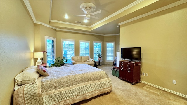 carpeted bedroom featuring ceiling fan, a raised ceiling, and crown molding