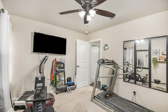 workout room with carpet and ceiling fan