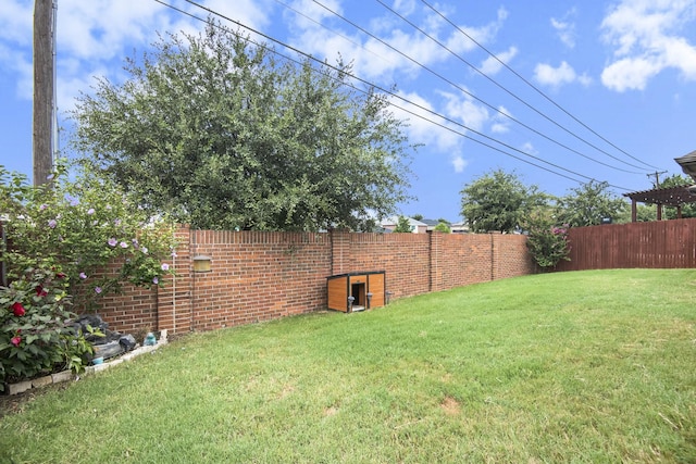 back of property with central air condition unit and a yard