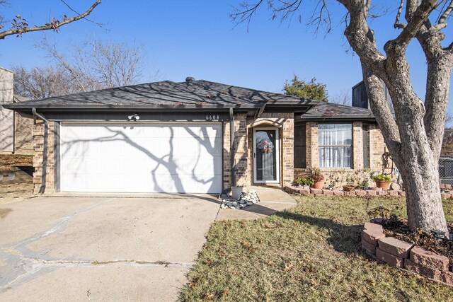 ranch-style house featuring a garage