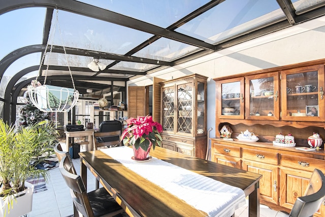 sunroom / solarium featuring beam ceiling and coffered ceiling