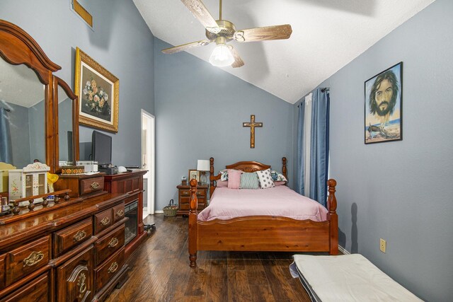 bedroom with ceiling fan, dark hardwood / wood-style floors, and lofted ceiling