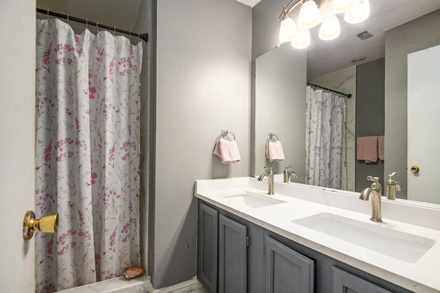 bathroom featuring vanity and walk in shower