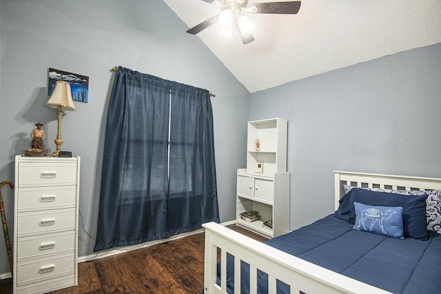 bedroom featuring ceiling fan, dark hardwood / wood-style floors, and lofted ceiling