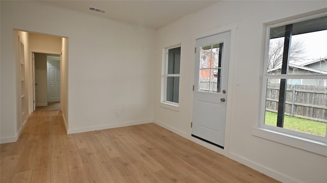 doorway to outside with light hardwood / wood-style floors