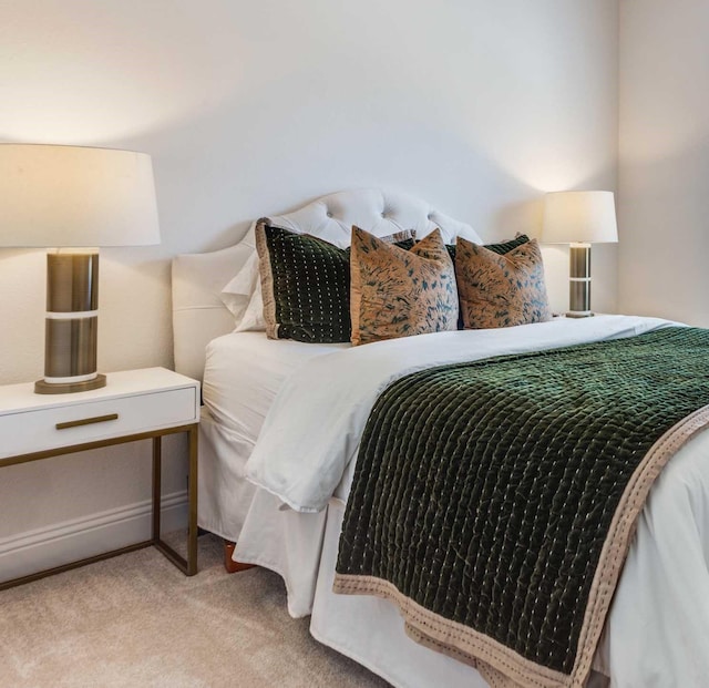 bedroom featuring light colored carpet