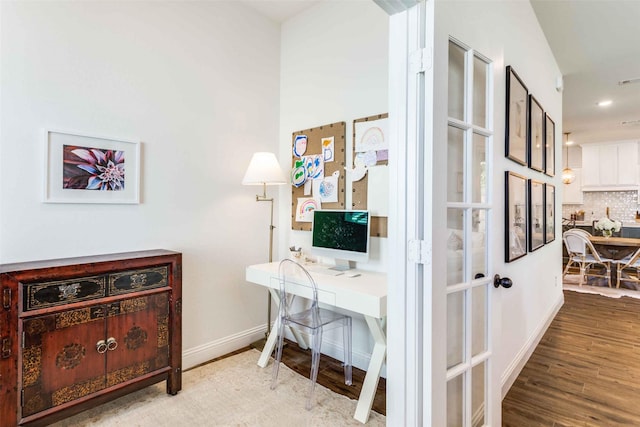 office space with light wood finished floors and baseboards