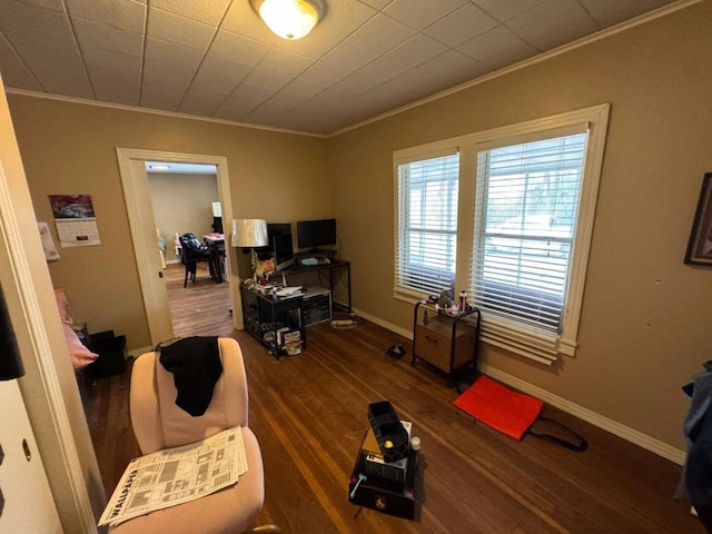 living room with ornamental molding and dark hardwood / wood-style floors