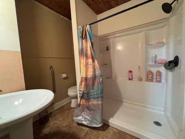 bathroom with wood ceiling, sink, curtained shower, and toilet