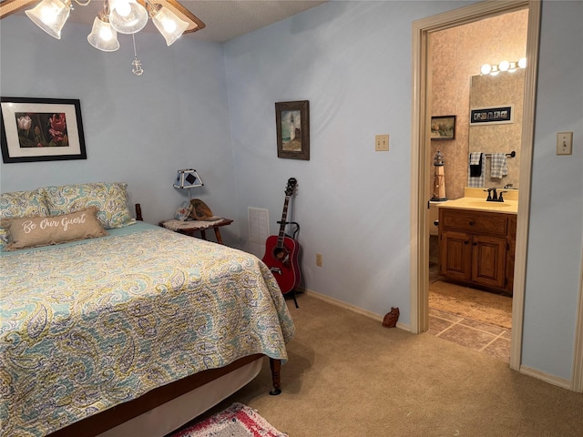 carpeted bedroom featuring connected bathroom, ceiling fan, and sink