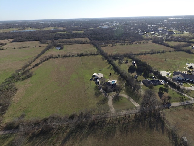 birds eye view of property with a rural view