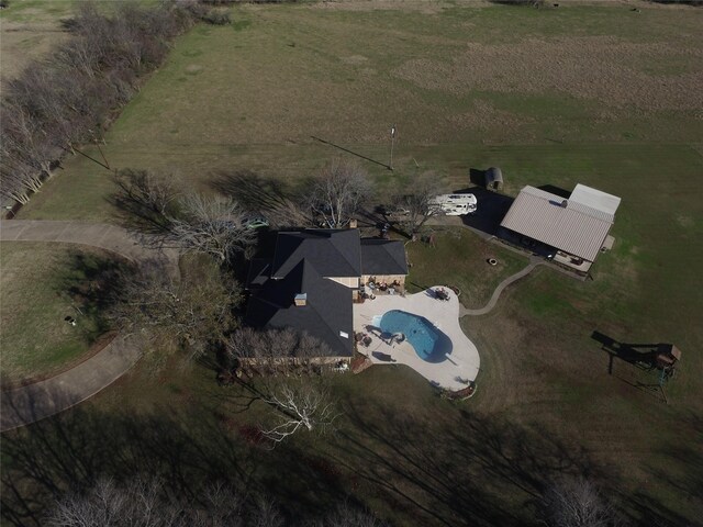 birds eye view of property with a rural view