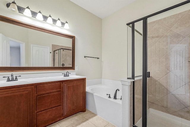 bathroom featuring tile patterned flooring, vanity, and plus walk in shower