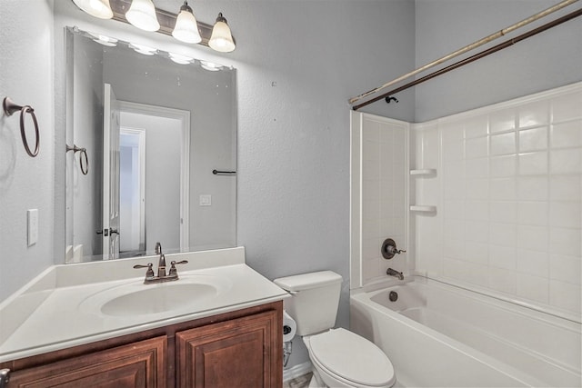 full bathroom featuring vanity, washtub / shower combination, and toilet